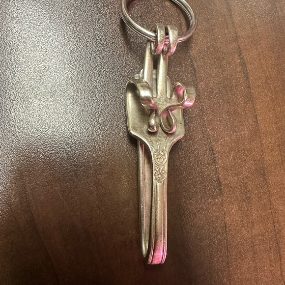 Silver fork bent into a key chain. It could also be worn as a necklace - Picture 2 of 3